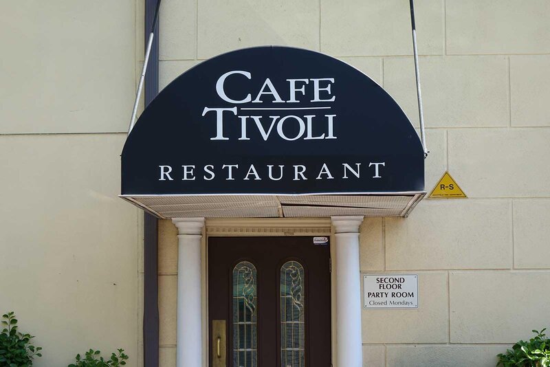 Restaurant enterance with Cafe Tivoli Restaurant on awning